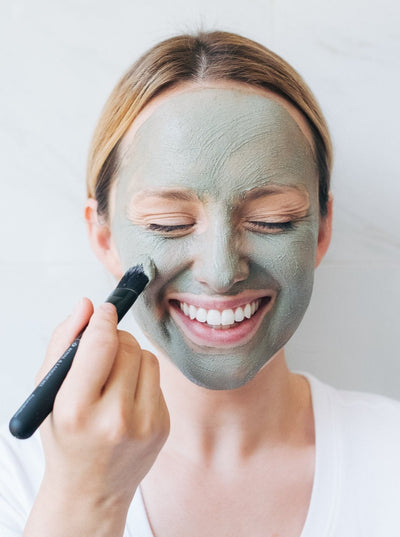 woman using modern hippie face mask